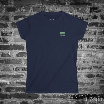 Navy blue t-shirt with a green battery icon and '100%' text on a brick wall background