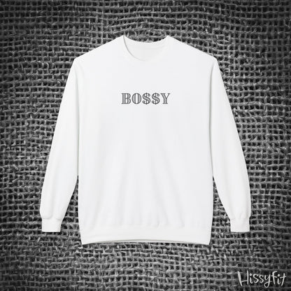 White sweatshirt with 'BOSSY' text on a textured gray background