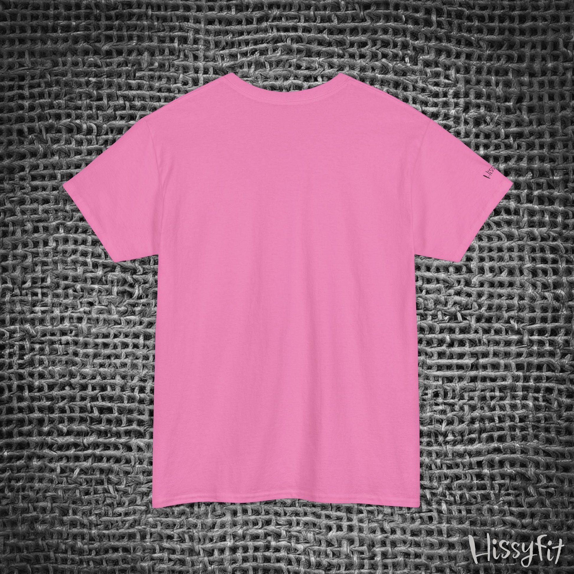Pink t-shirt on a textured gray background