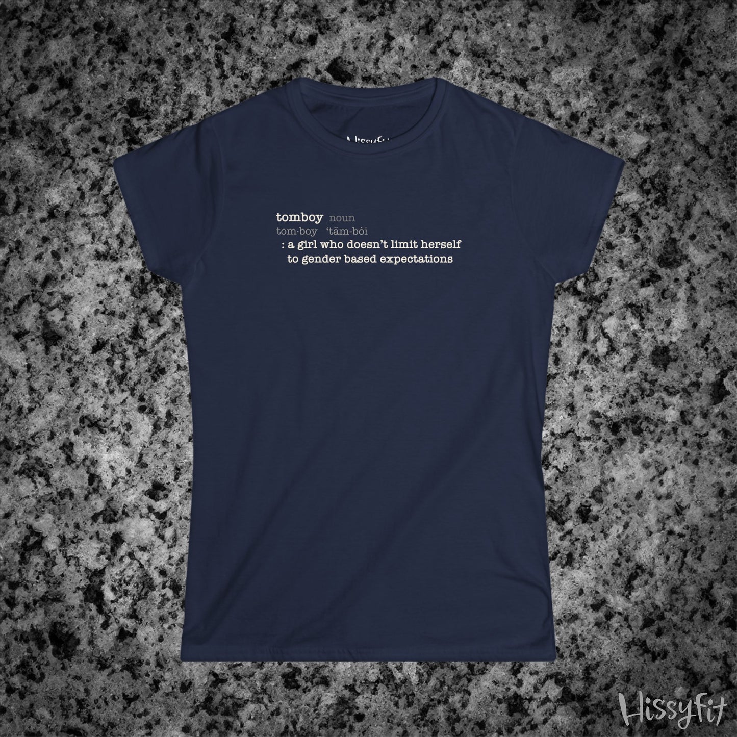 Navy blue t-shirt with text 'Tomboy:definition' on a gray granite surface, featuring the brand 'Hissyfit'.