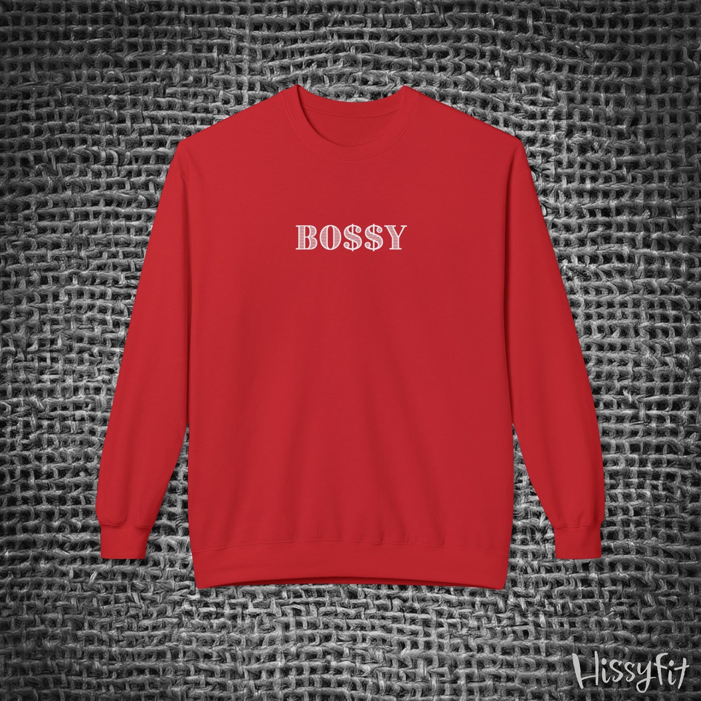 Red sweatshirt with 'BOSSY' text on a textured gray background