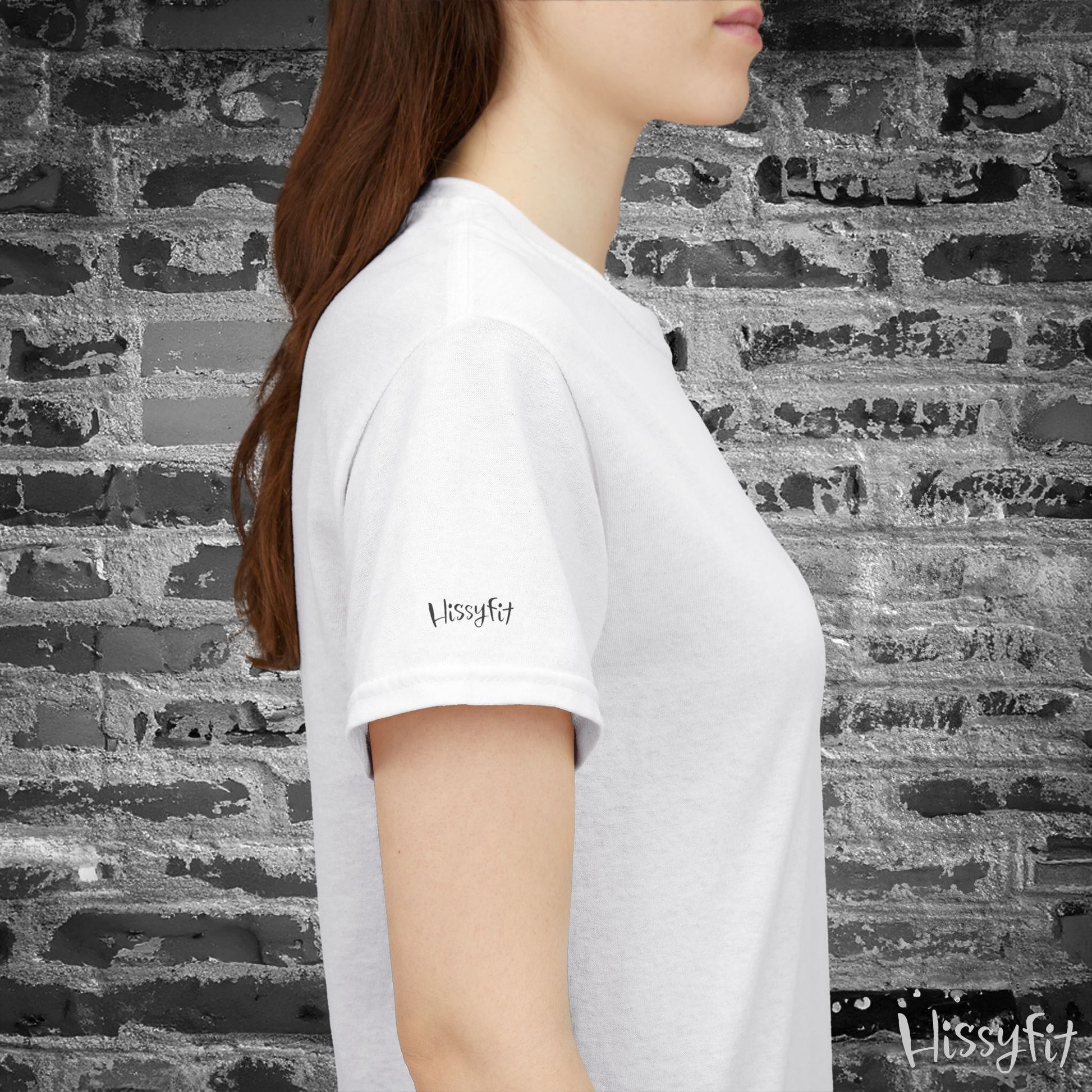 Person wearing a white t-shirt with 'Hissyfit' logo against a textured wall.