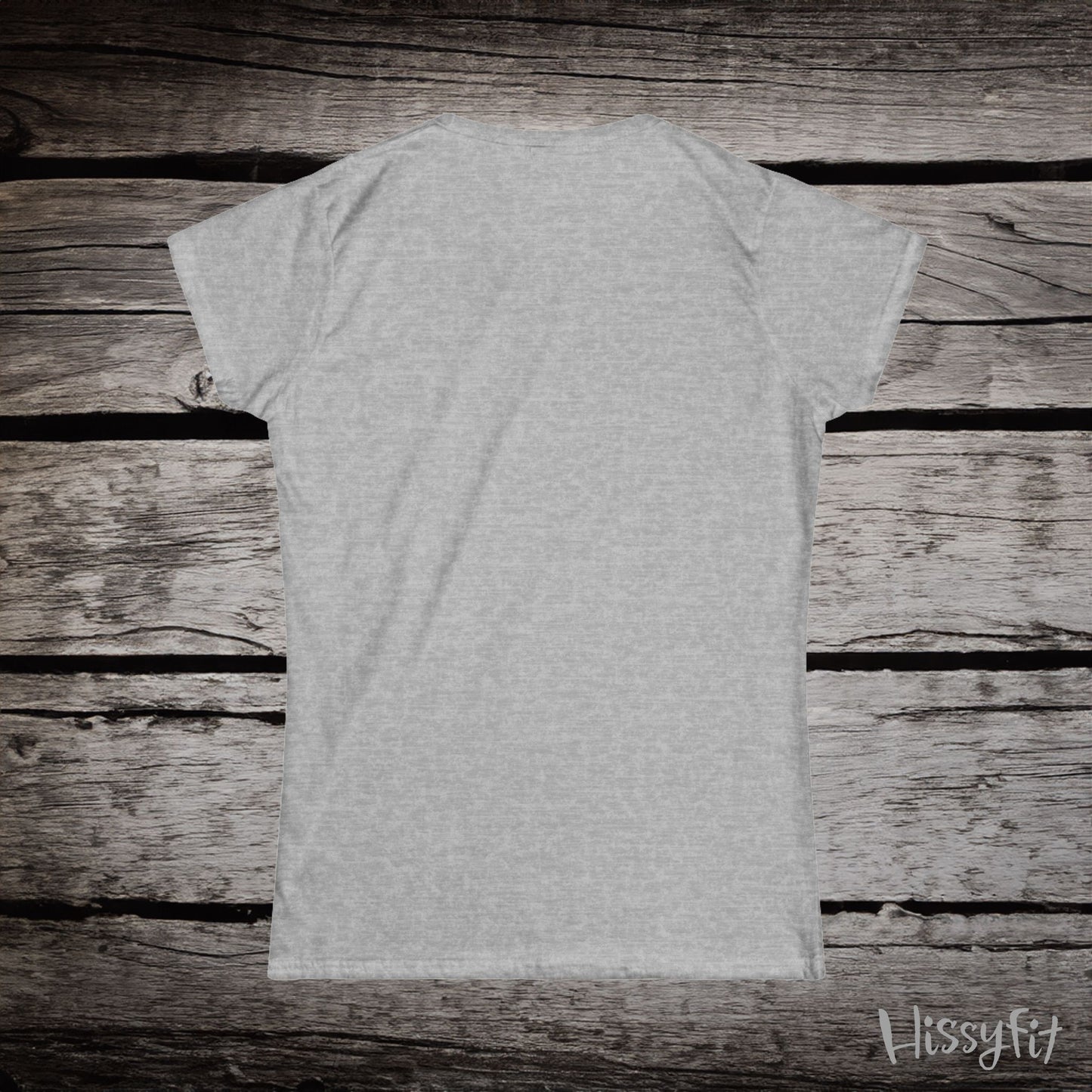Gray t-shirt on a wooden surface with 'Hissyfit' branding.