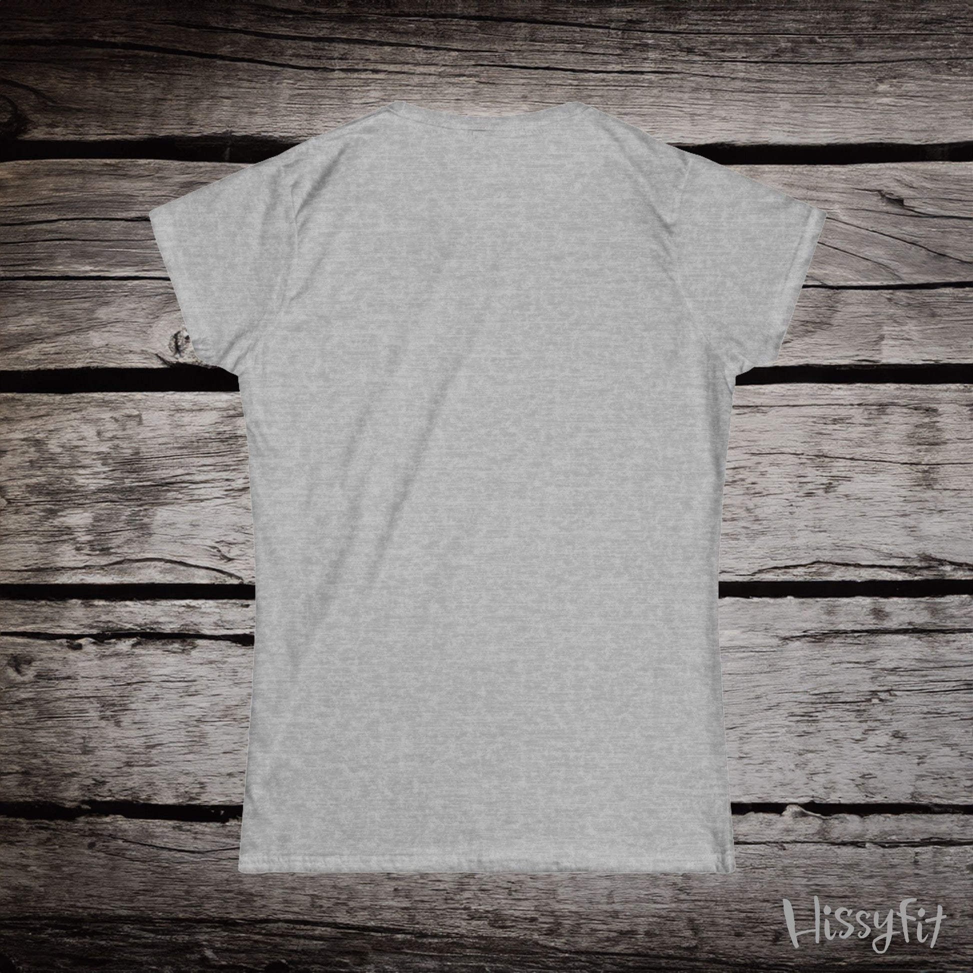 Gray t-shirt on a wooden surface with 'Hissyfit' branding.