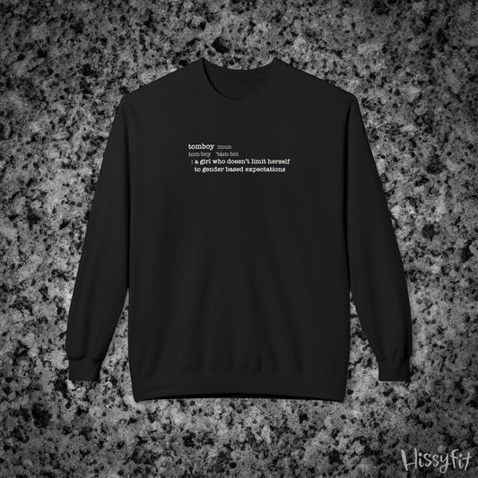 Black sweatshirt with text definition of "Tomboy" on a gray and black speckled background