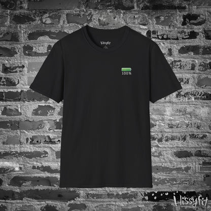 Black t-shirt with a green battery symbol displaying '100 percent charged' on a brick wall background