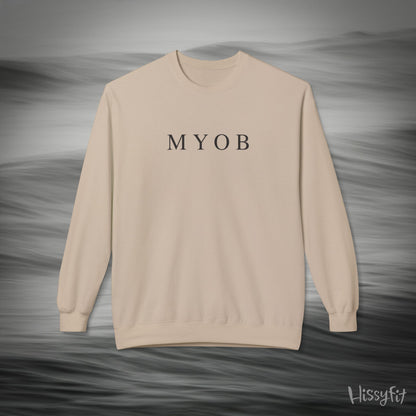 Beige sweatshirt with 'MYOB' text on a gray background