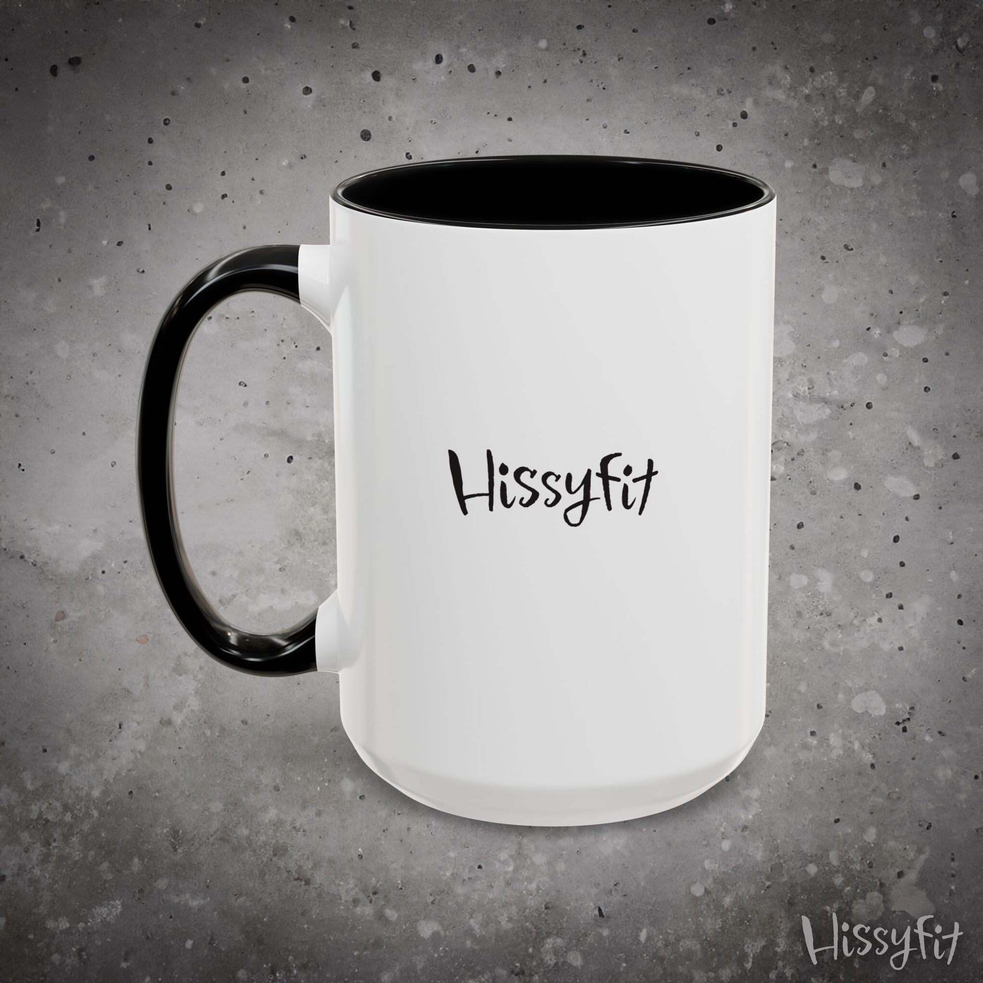 White mug with black interior and handle on a gray background, featuring the word 'Hissyfit'.