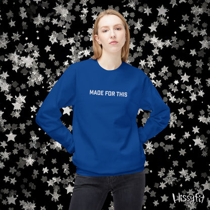 Person wearing a blue sweatshirt with 'MADE FOR THIS' text against a star-patterned background