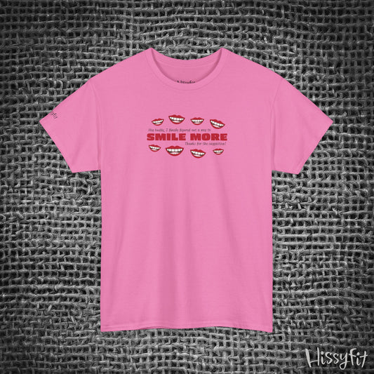 Pink t-shirt with text 'Smile more' and smiley faces on a textured gray background