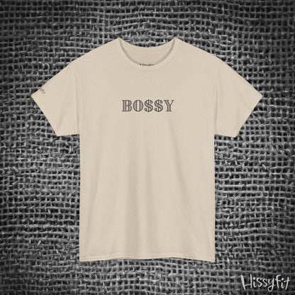 Beige t-shirt with 'BOSSY' text on a textured gray background