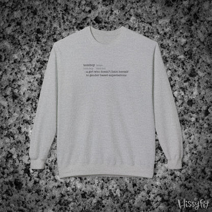 Gray sweatshirt with text definition of "Tomboy" on a gray and black speckled background