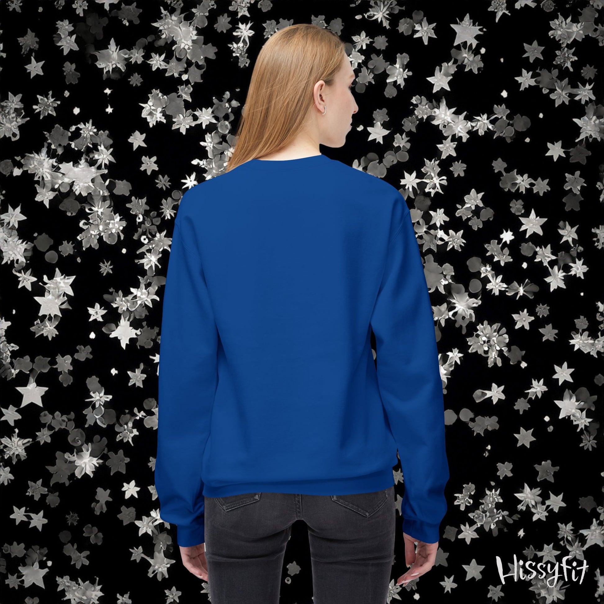 Person wearing a blue sweatshirt with a starry background