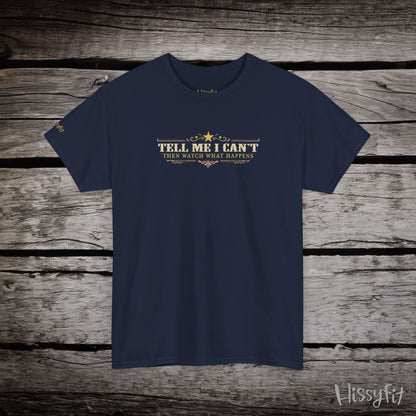 Navy blue t-shirt with text 'Tell me I can't then watch what happens' on a wooden surface, featuring the brand 'Hissyfit'.