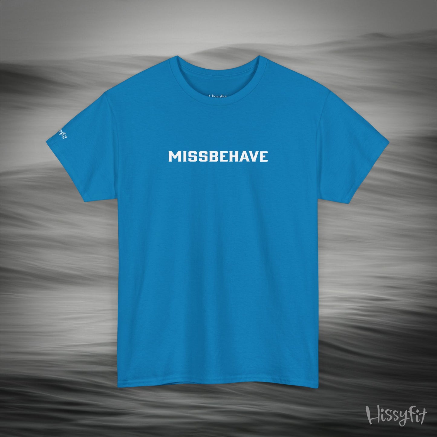 Blue t-shirt with 'MISSBEHAVE' text on a gray background