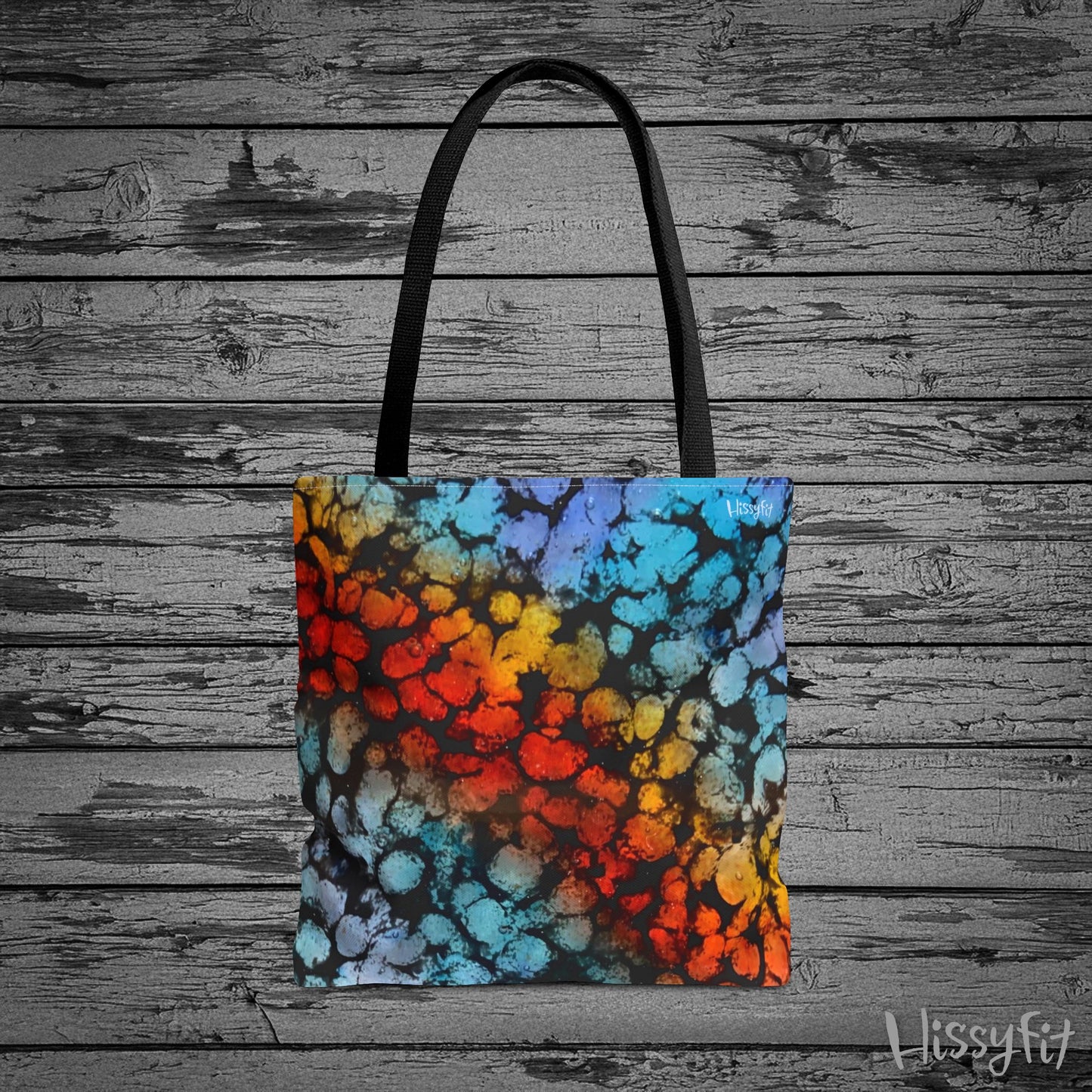 Tote bag with colorful abstract pattern on a wooden background