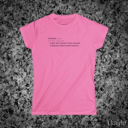 Pink t-shirt with text 'Tomboy:definition' on a gray granite surface, featuring the brand 'Hissyfit'.