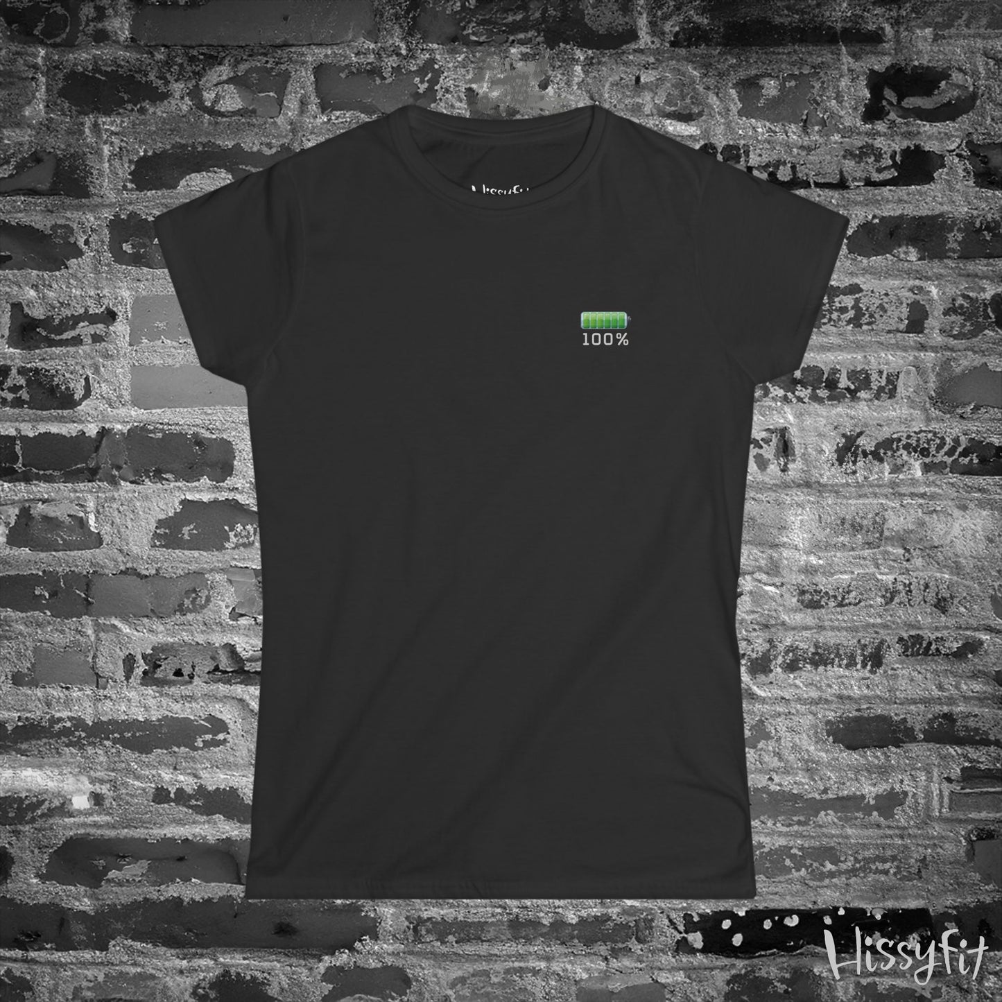 Black t-shirt with a green battery symbol and '100%' charged on a brick wall background