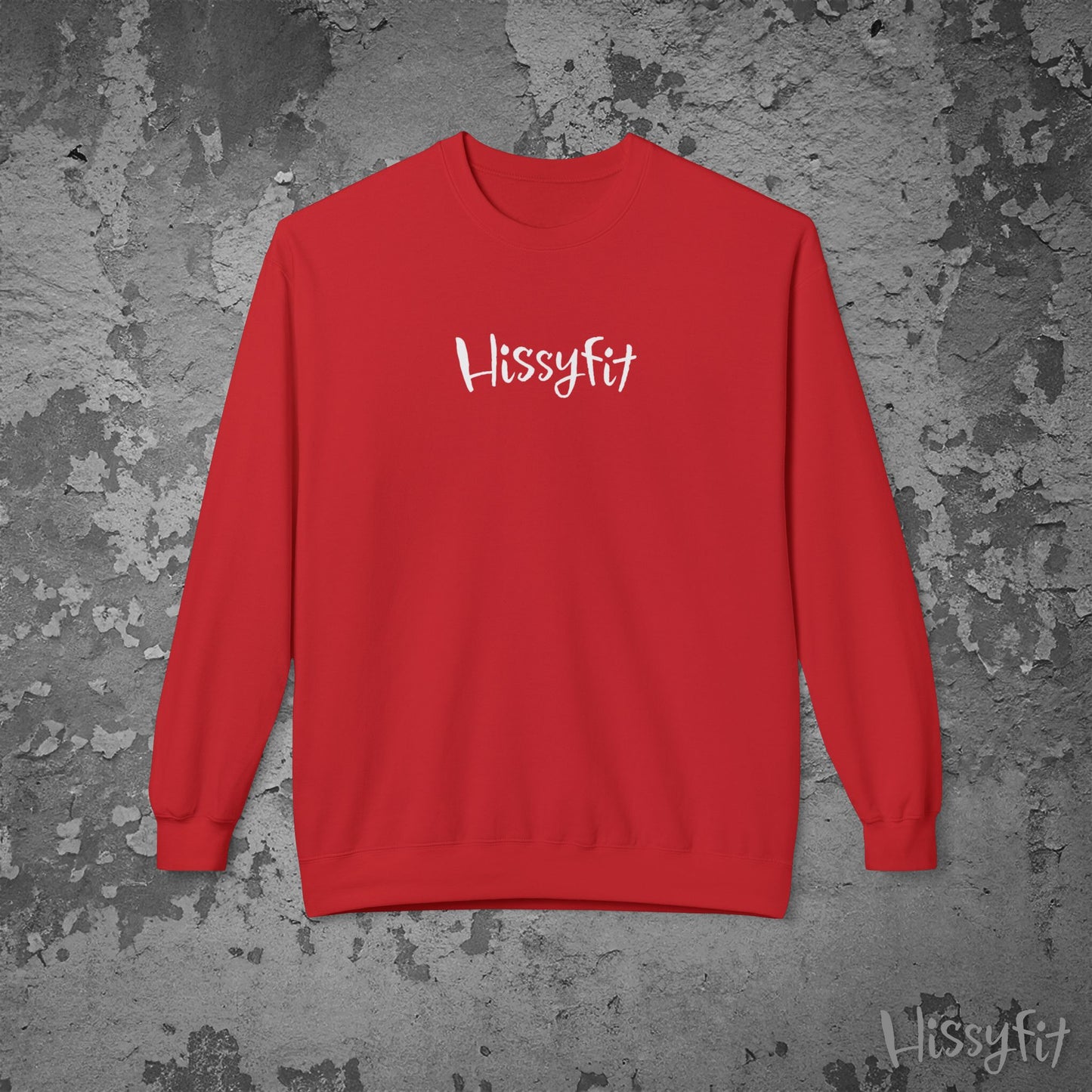 Red sweatshirt with 'Hissyfit' logo on a textured gray background
