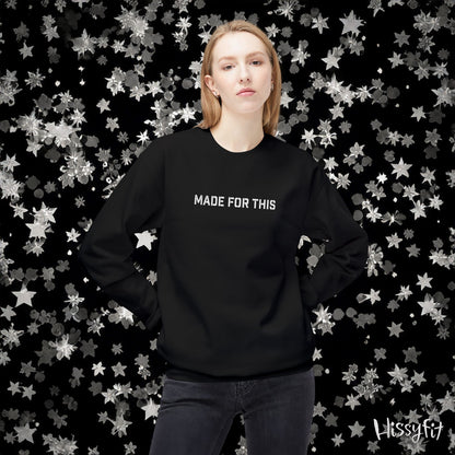 Person wearing a black sweatshirt with 'MADE FOR THIS' text against a star-patterned background