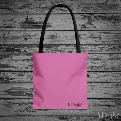 Pink tote bag with 'Hissyfit' branding on a wooden surface