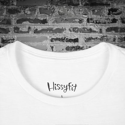 White printed t-shirt label with 'Hissyfit' text on a brick wall background
