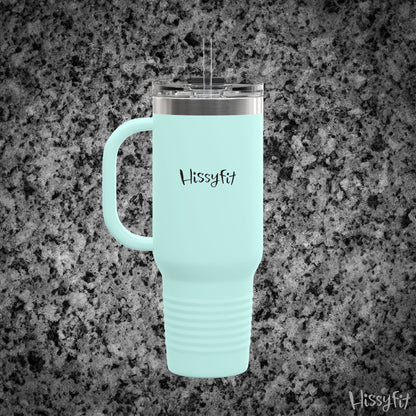 Light blue travel mug with handle on a gray granite background, featuring the brand 'Hissyfit'.