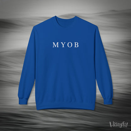 Blue sweatshirt with 'MYOB' text on a gray background