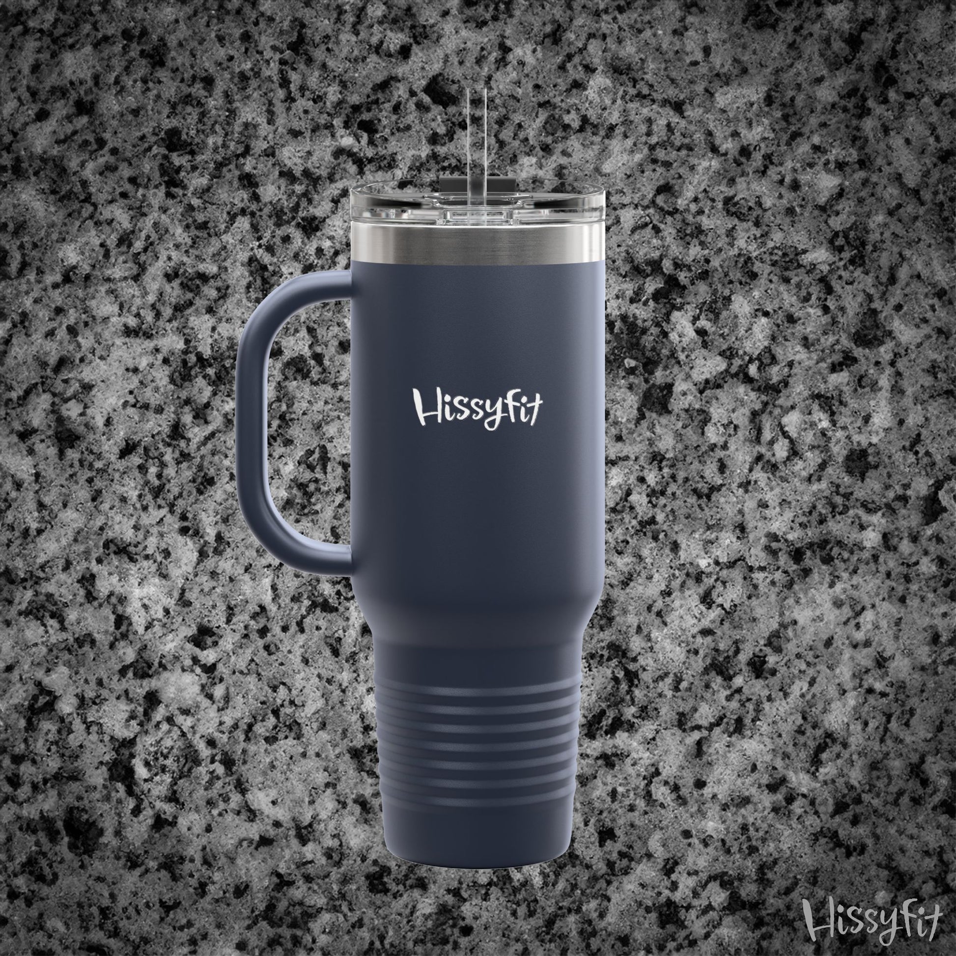 Blue travel mug with handle on a gray granite background