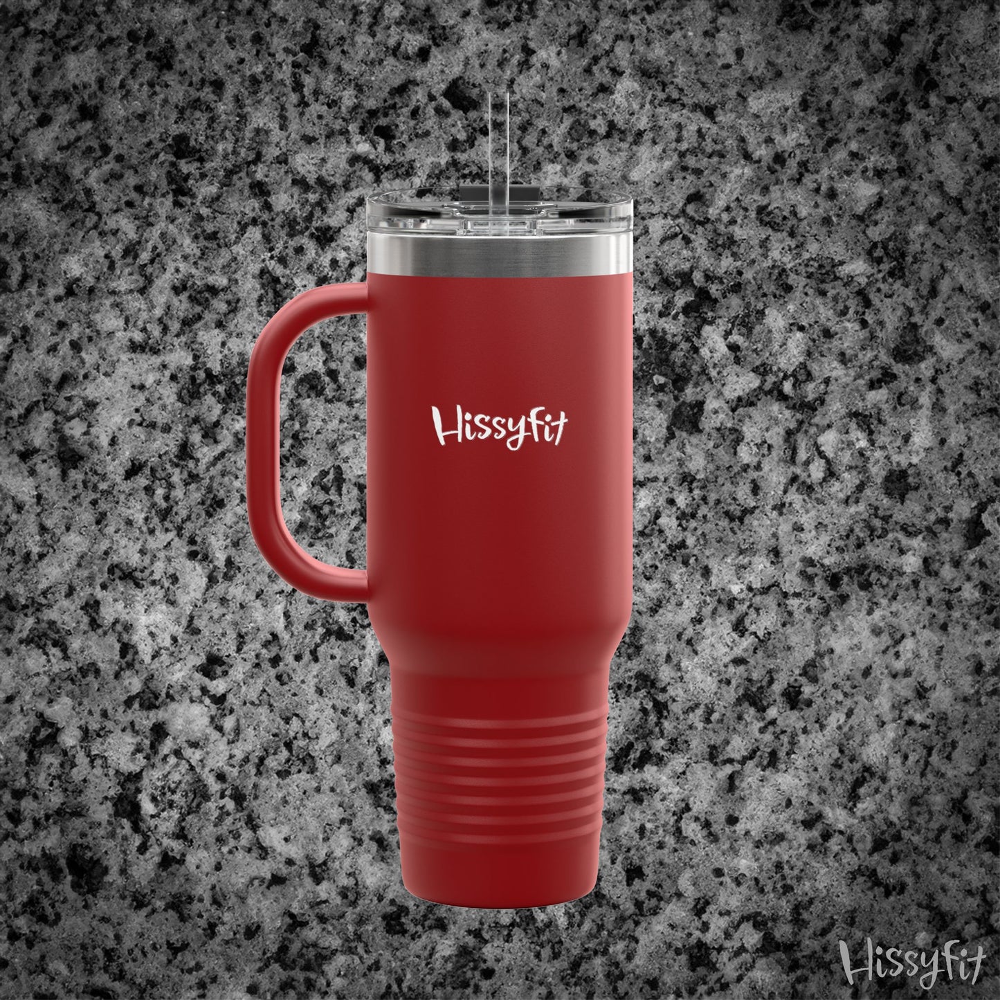 Red travel mug with silver lid on a gray granite surface, featuring the 'Hissyfit' brand.