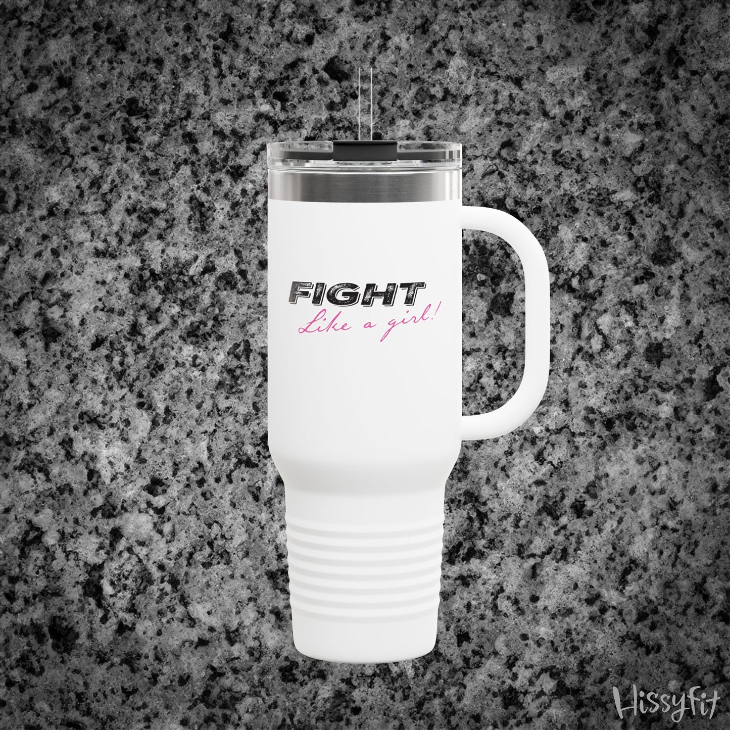 White travel mug with 'Fight Like a Girl' text on a gray granite surface, featuring the brand 'Hissyfit'.