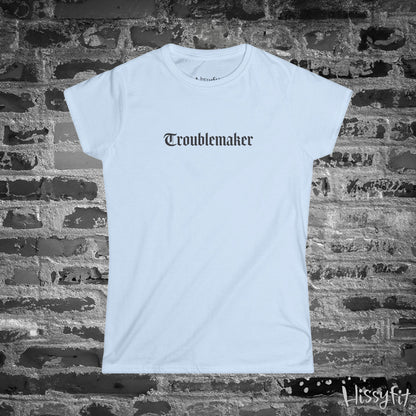 Light Blue t-shirt with 'Troublemaker' text on a brick wall background