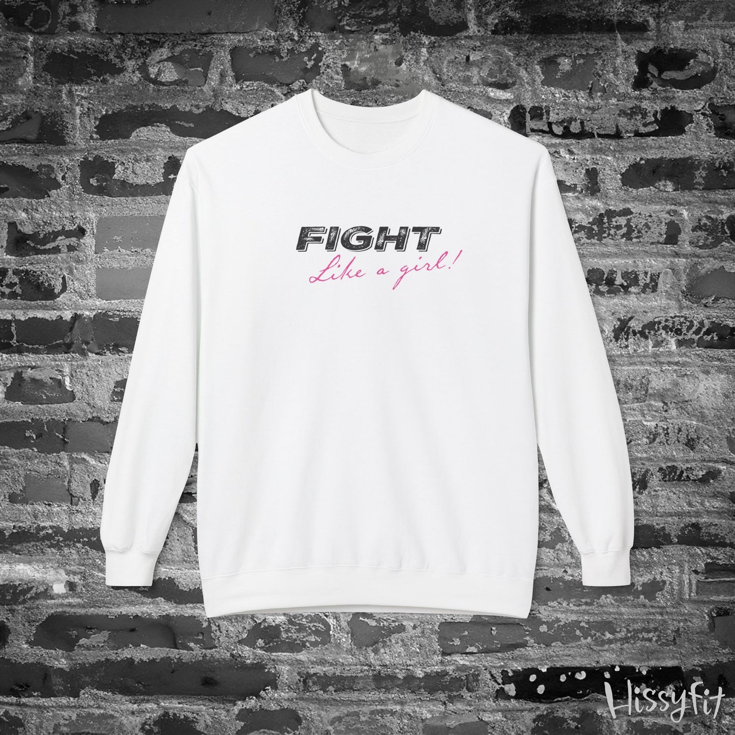 White sweatshirt with 'Fight Like a Girl' text on a brick wall background