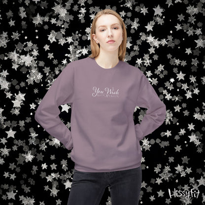 Person wearing a purple sweatshirt with text on a star-patterned background