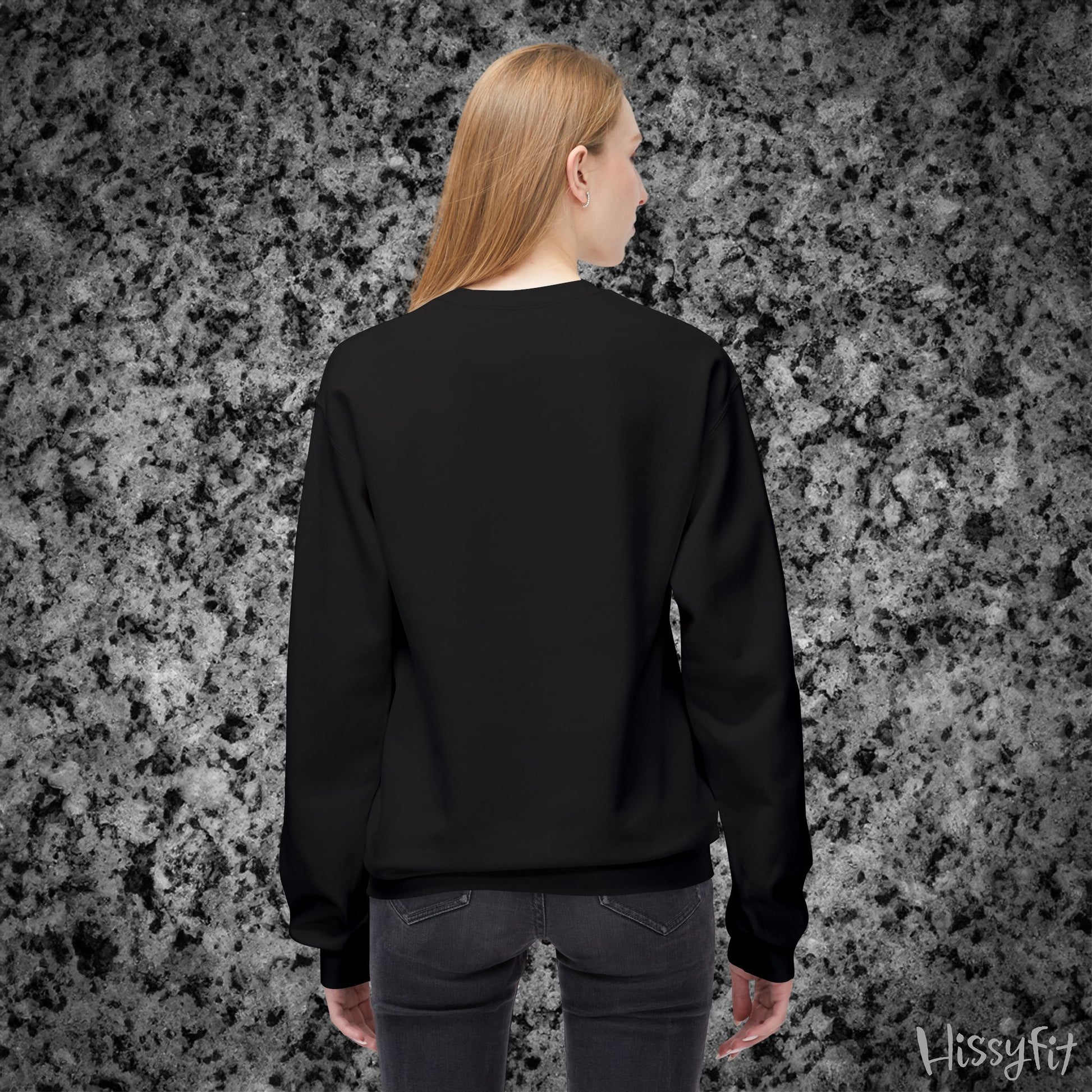 Person wearing a black sweatshirt against a textured gray background with 'Hissyfit' branding.