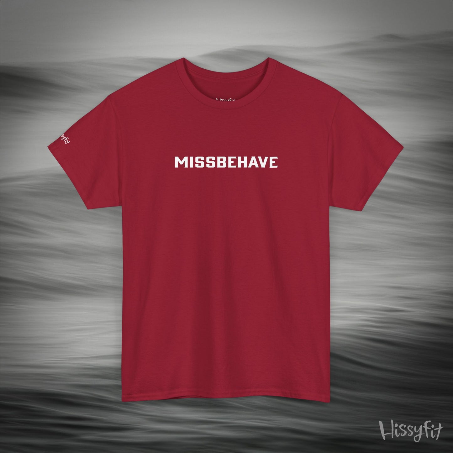 Red t-shirt with 'MISSBEHAVE' text on a gray background