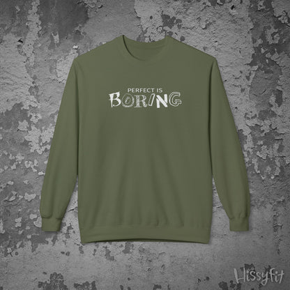 Green sweatshirt with 'PERFECT IS BORING' text on a textured gray background