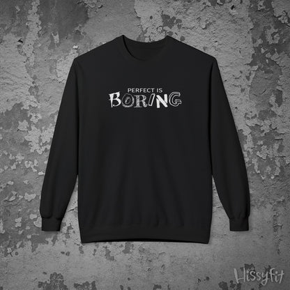 Black sweatshirt with 'Perfect is Boring' text on a textured gray background