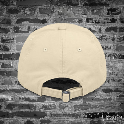 Beige cap on a textured gray background