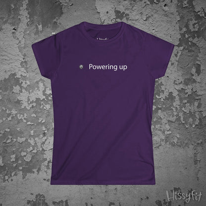 Purple t-shirt with 'Powering up' text on a textured gray background