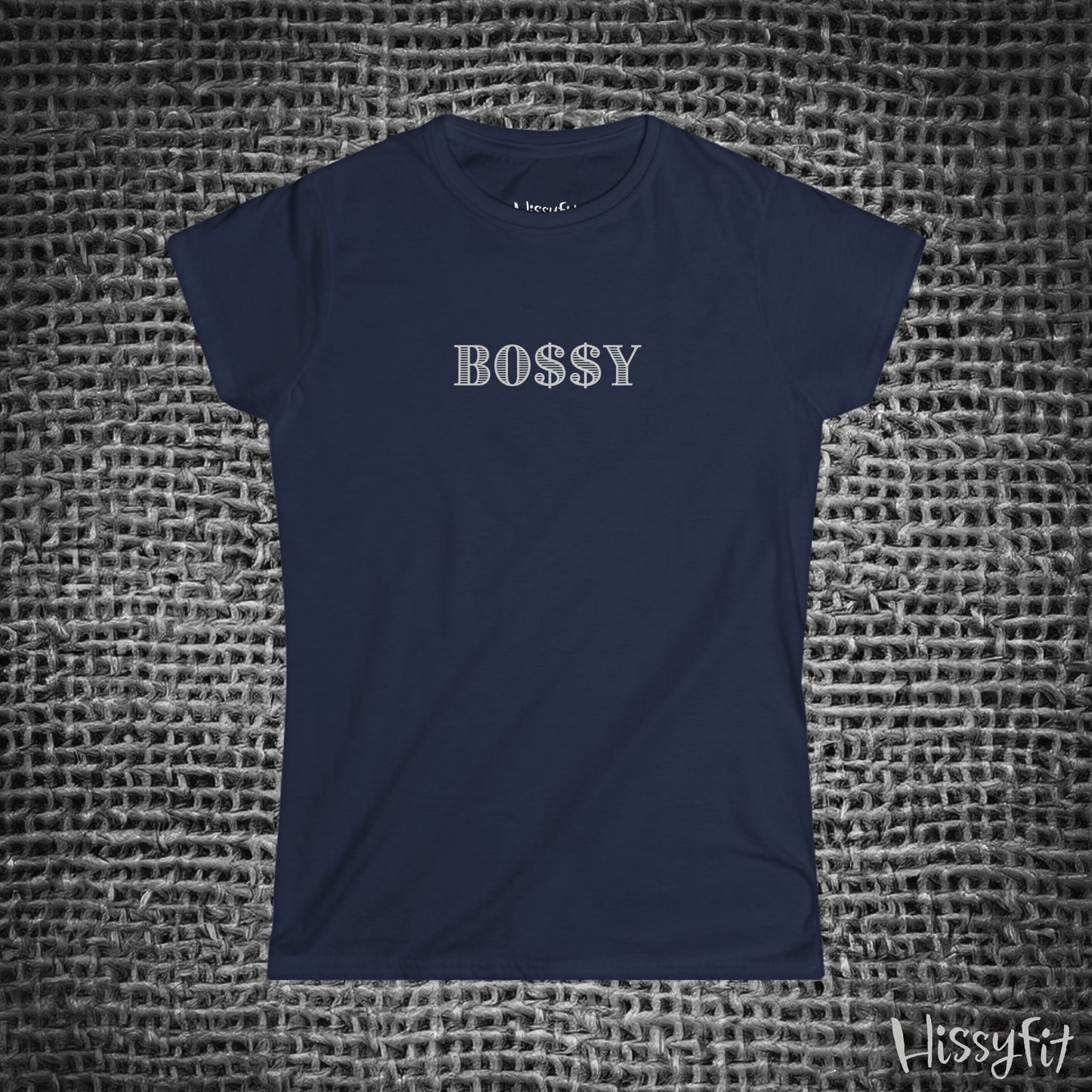 Navy blue t-shirt with 'BOSSY' text on a textured gray background