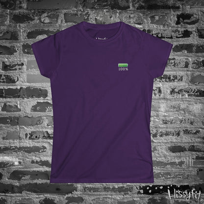 Purple t-shirt with a green fully charged battery icon on a brick wall background