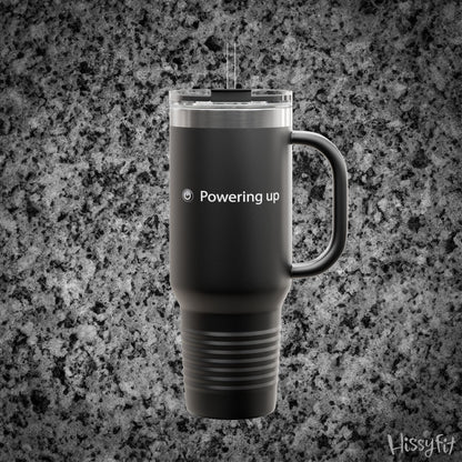 Black travel mug with 'Powering up' text on a gray granite background