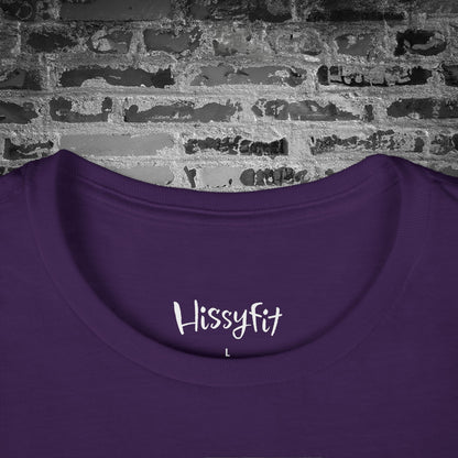 Purple shirt with 'Hissyfit' text on a brick wall background