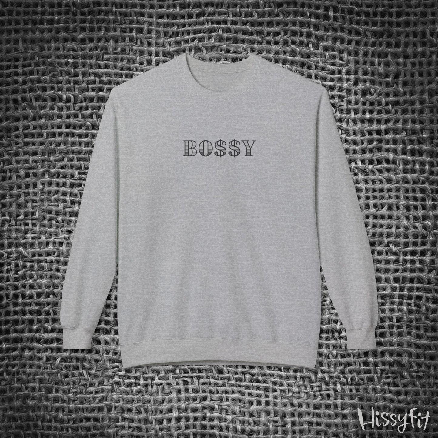 Gray sweatshirt with 'BOSSY' text on a textured black and white background
