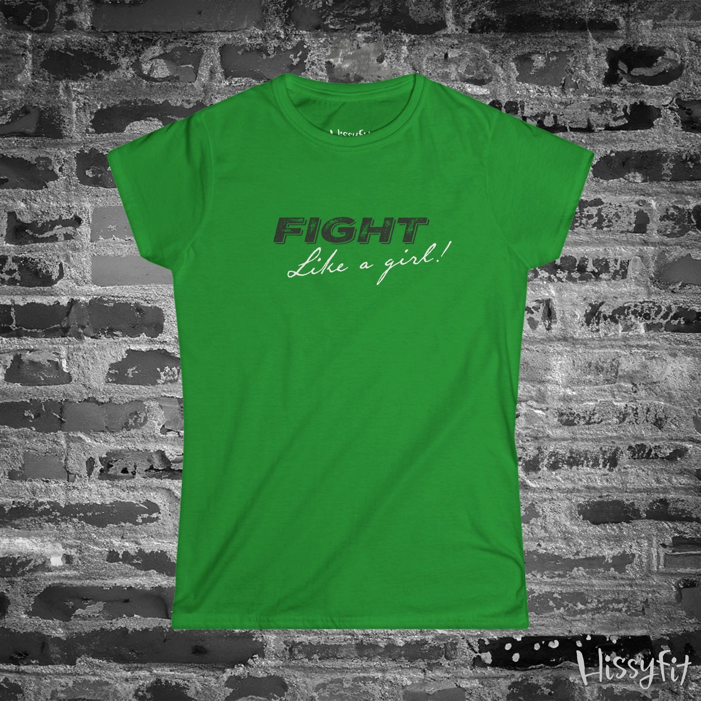 Green t-shirt with 'Fight Like a Girl!' text on a brick wall background