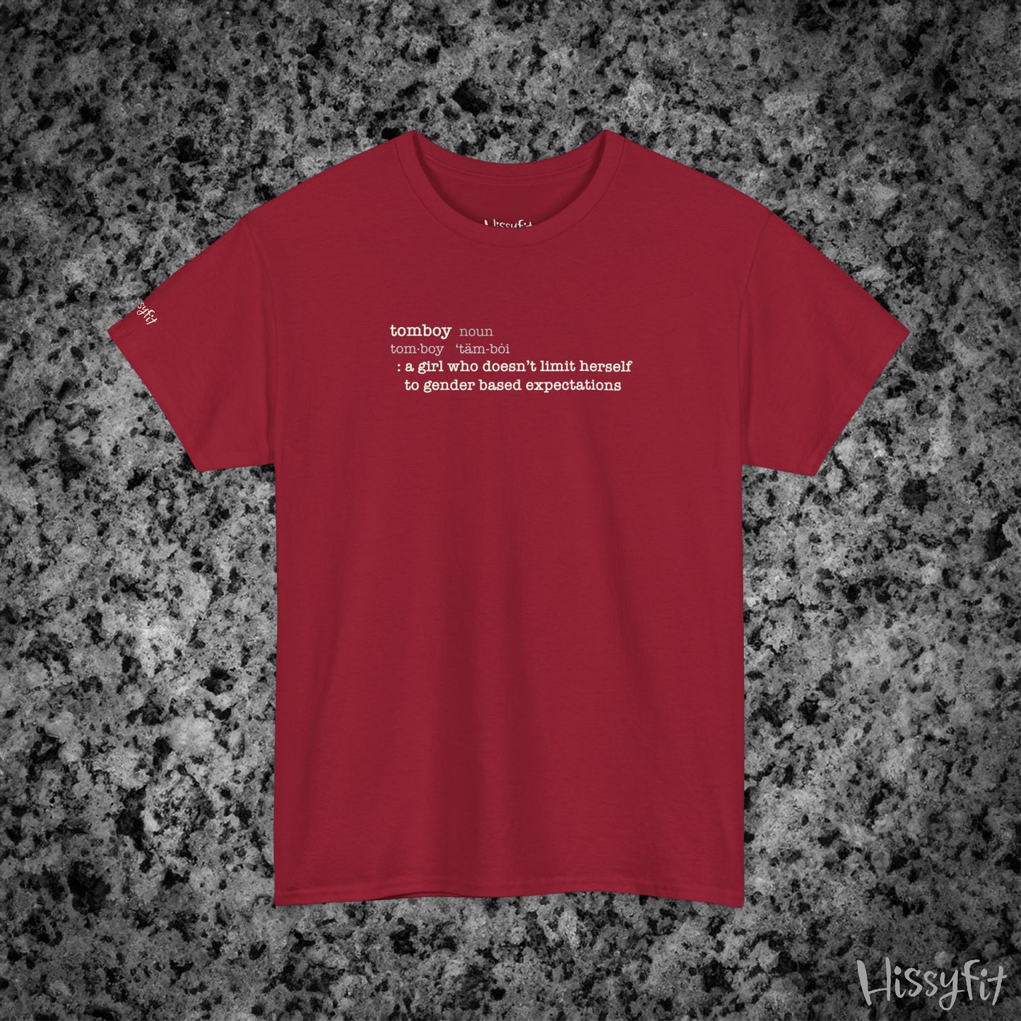 Red t-shirt with text 'Tomboy:definition' on a gray and black speckled background, featuring the brand 'Hissyfit'.