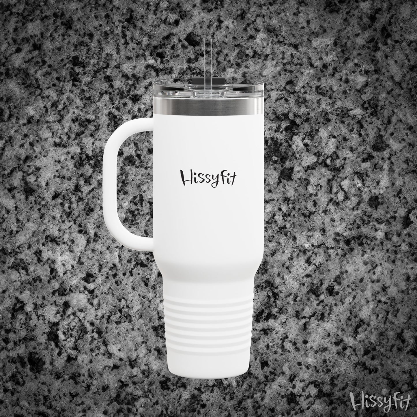 White travel mug with 'Hissyfit' branding on a gray granite surface