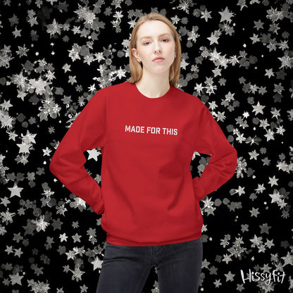 Person wearing a red sweatshirt with 'MADE FOR THIS' text against a star-patterned background