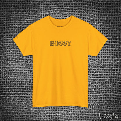 Yellow t-shirt with 'BOSSY' text on a textured gray background